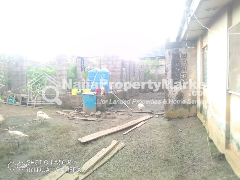bungalow and an uncompleted duplex for sale